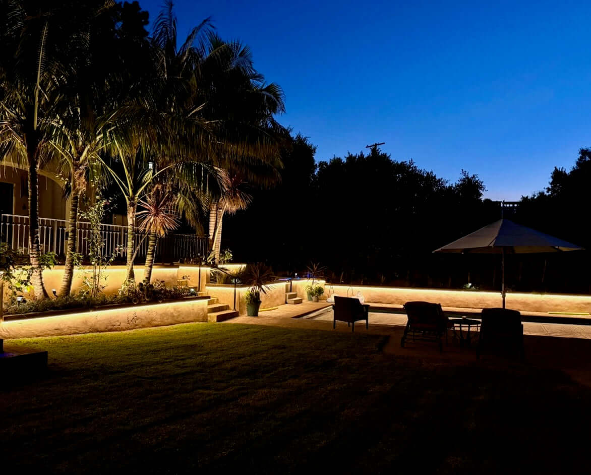 backyard illuminated by white strip lights