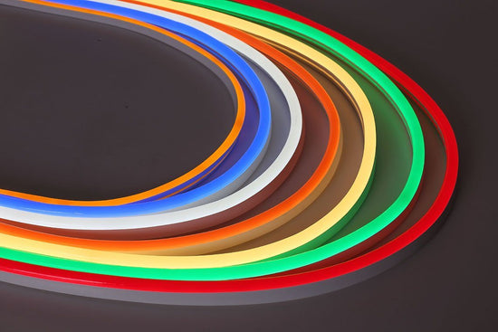7 illuminated segments of led neon strip lights arranged from left to right: orange, blue, white, amber, yellow, green, and red