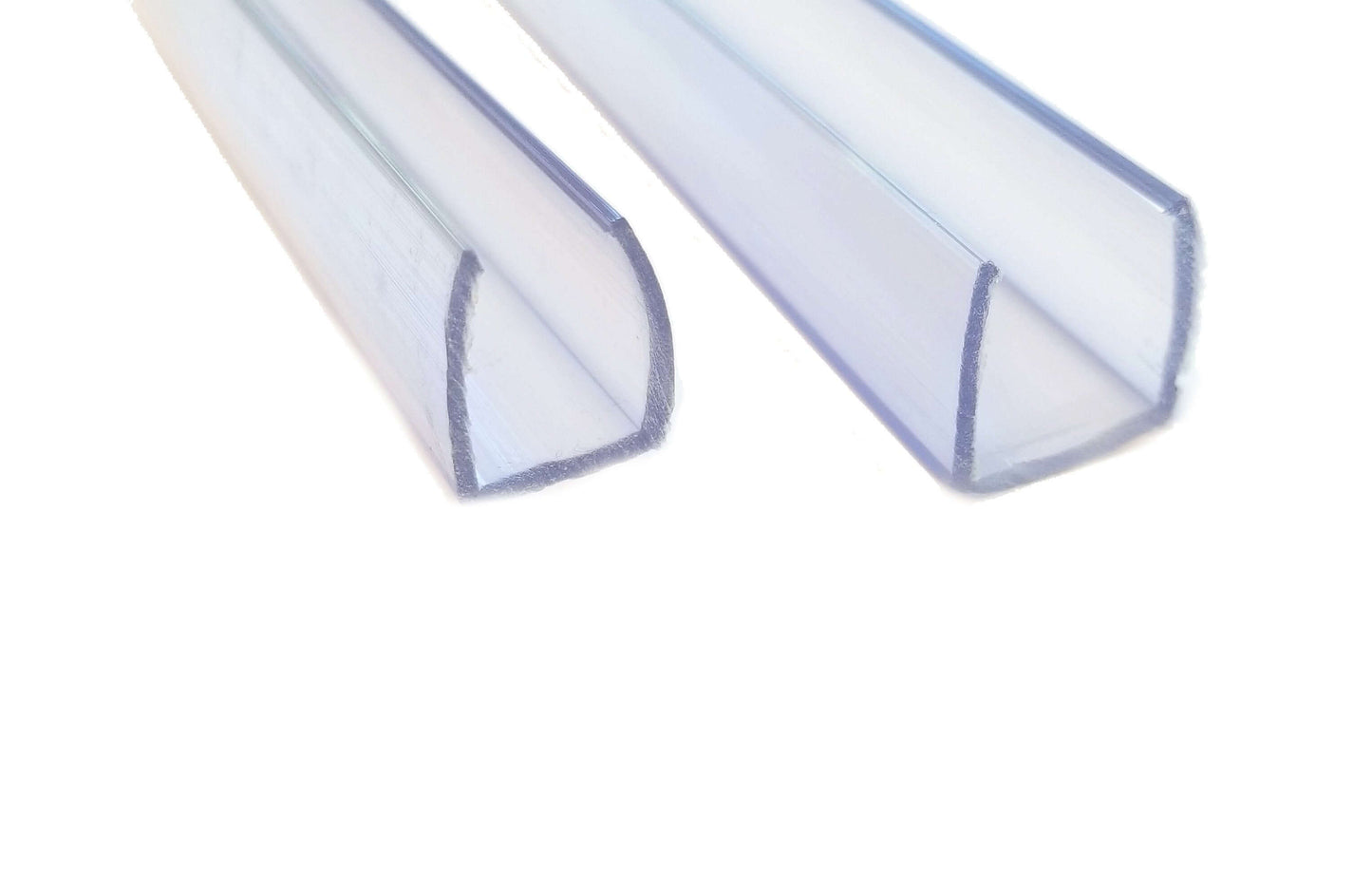two pieces of clear pvc led channel in different widths; thinner on left, wider on right