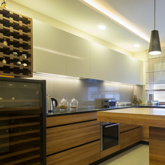 modern wood finish kitchen illuminated by linear led light bars