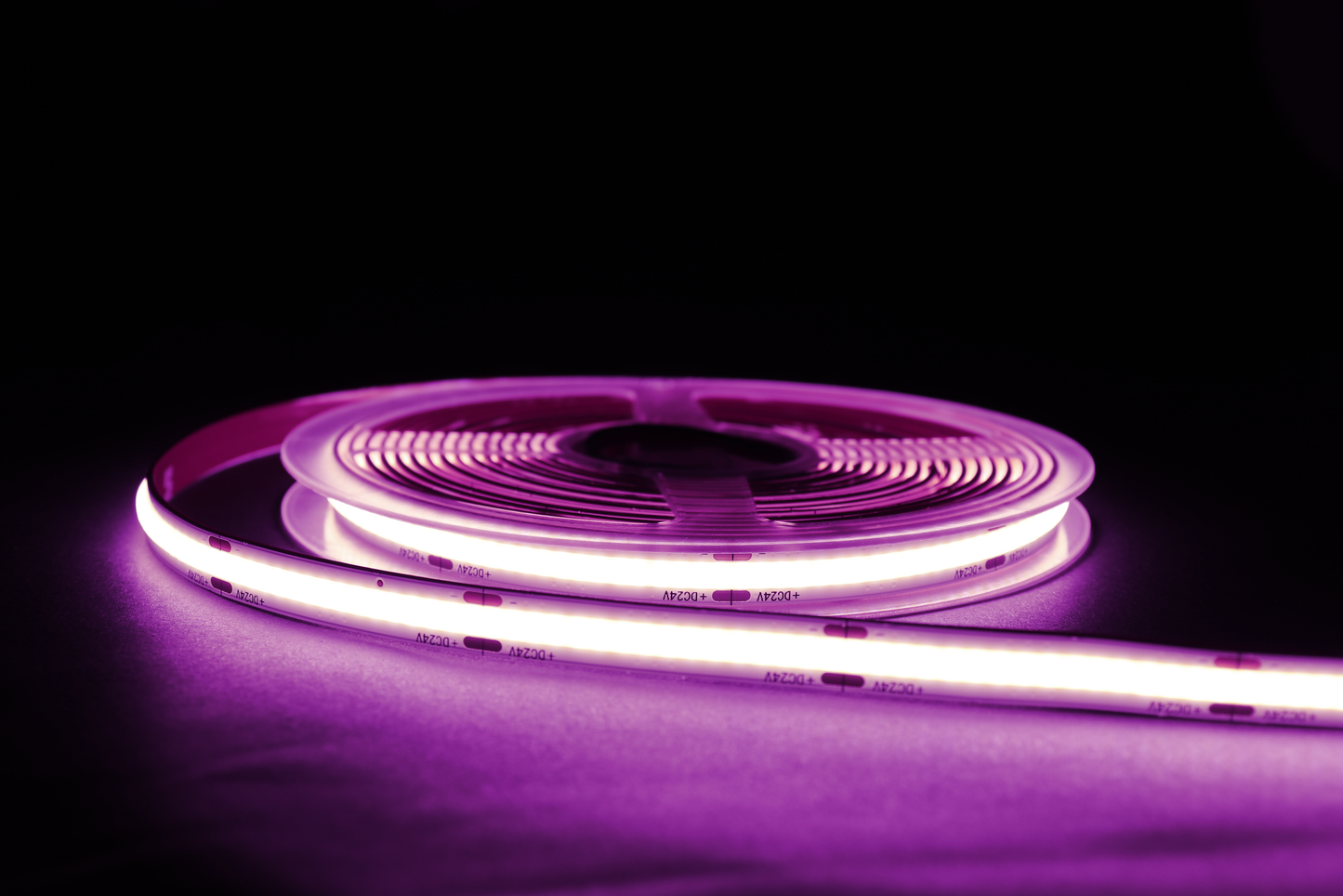 illuminated purple dotless LED strip with dark background