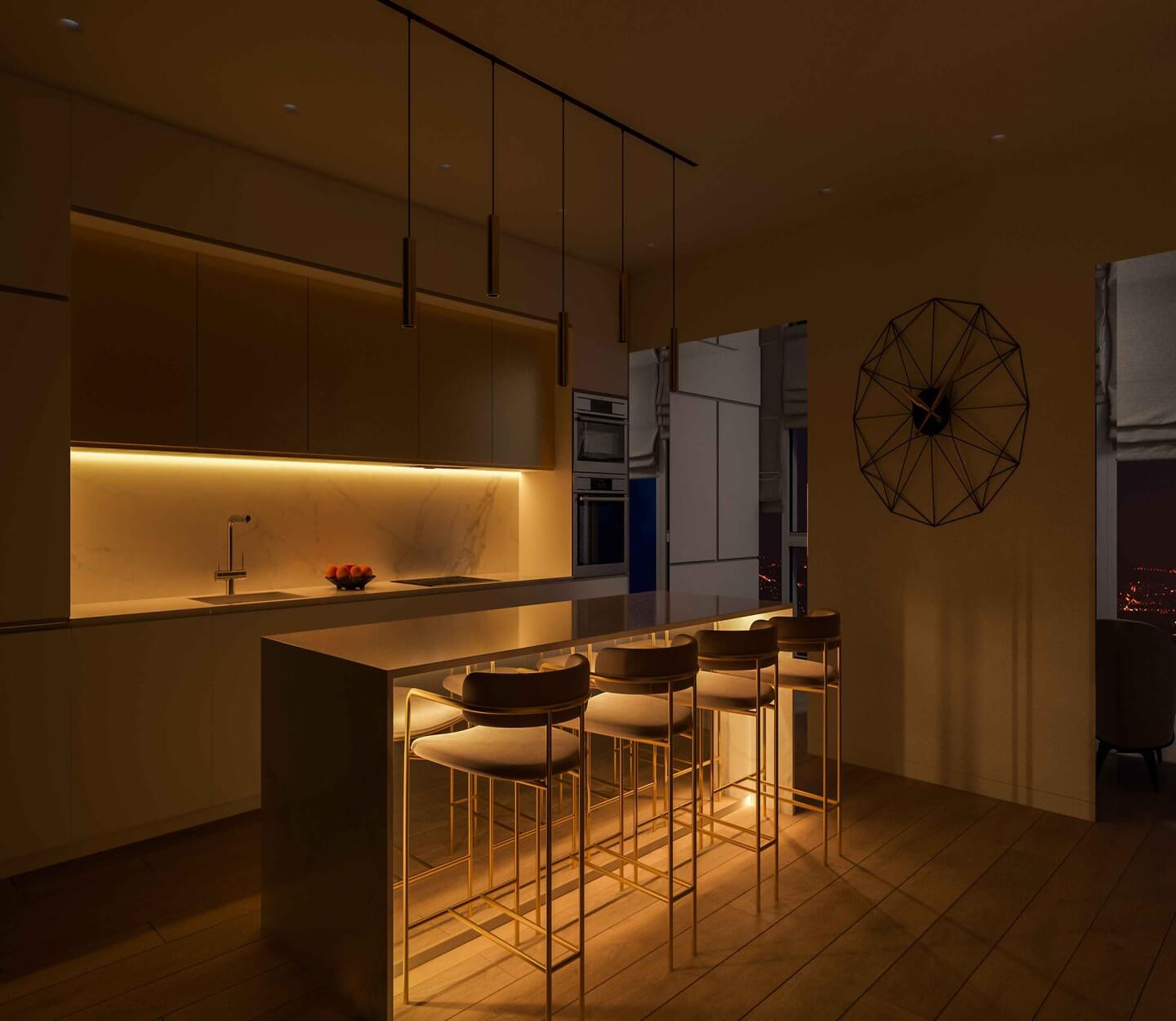 dark kitchen with under counter and island illuminated with warm glow from led strip lights
