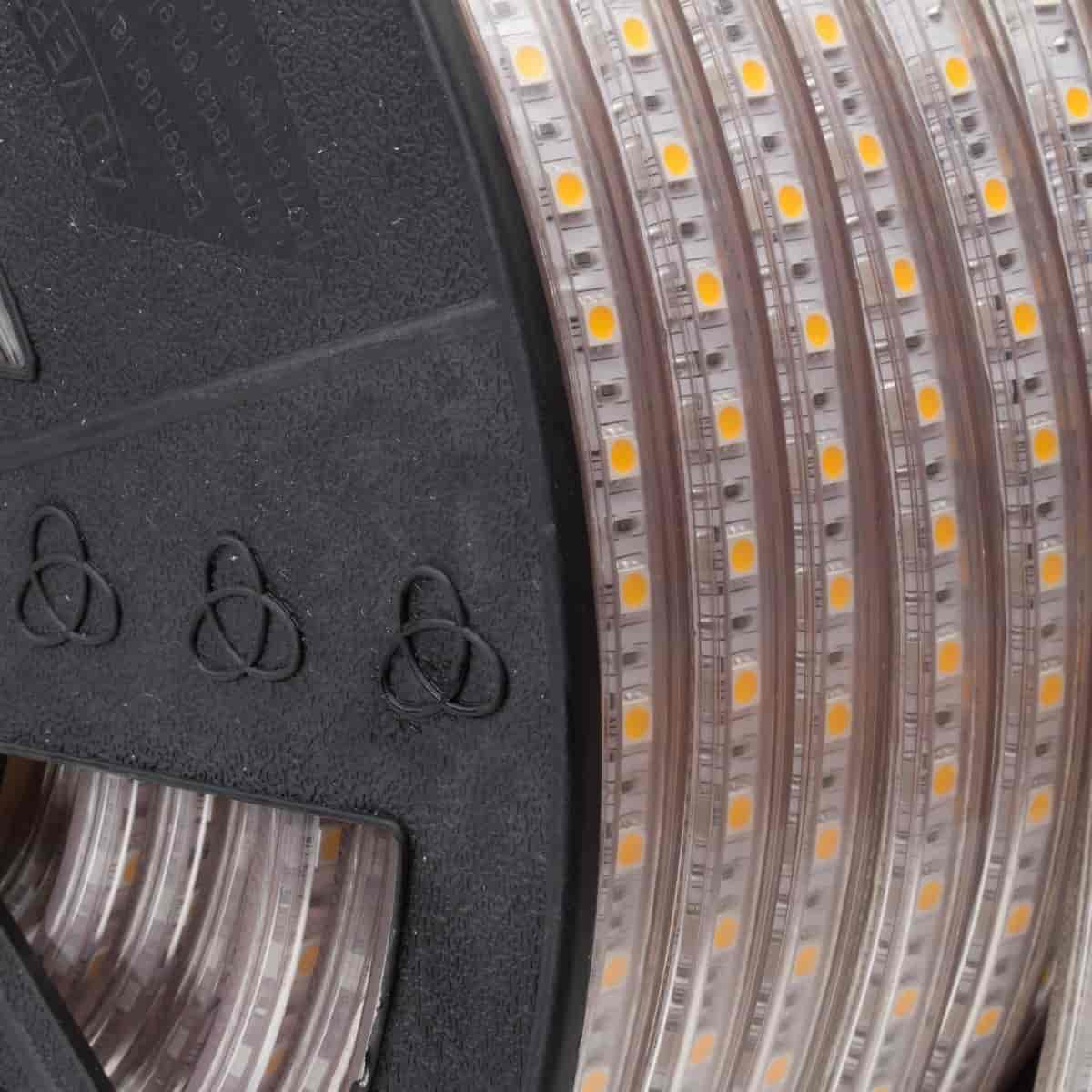 Load image into Gallery viewer, 120v led strip light reel on its side with visible yellow chips
