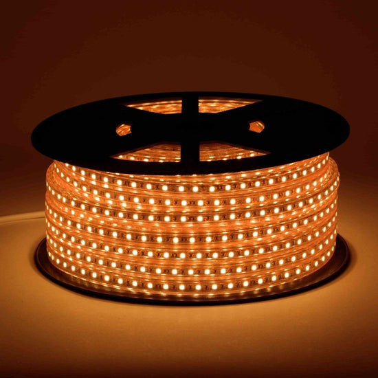 120V led strip lights on black reel displaying vivid light intense amber color