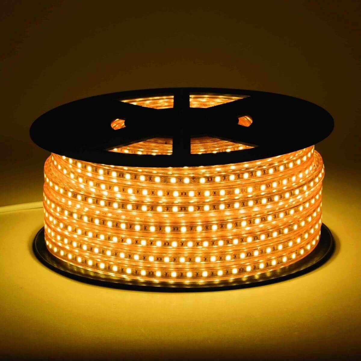 120V led strip lights on black reel displaying vivid light in intense 2200k warm white color