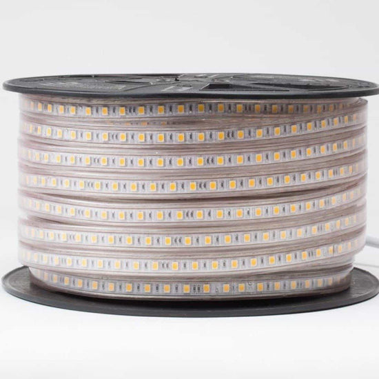 120V led strip lights with visible yellow led chips wound tightly on black reel