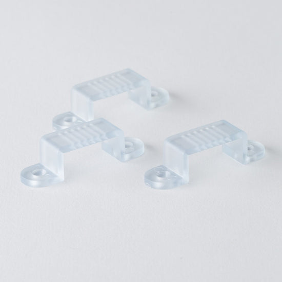 three clear mounting clips