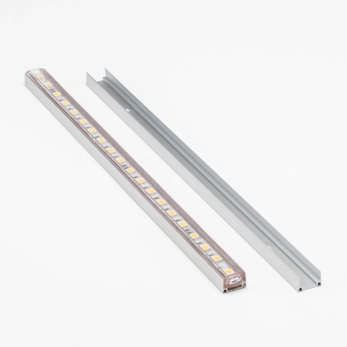 two aluminum u channel tracks, one with an led strip light laid in