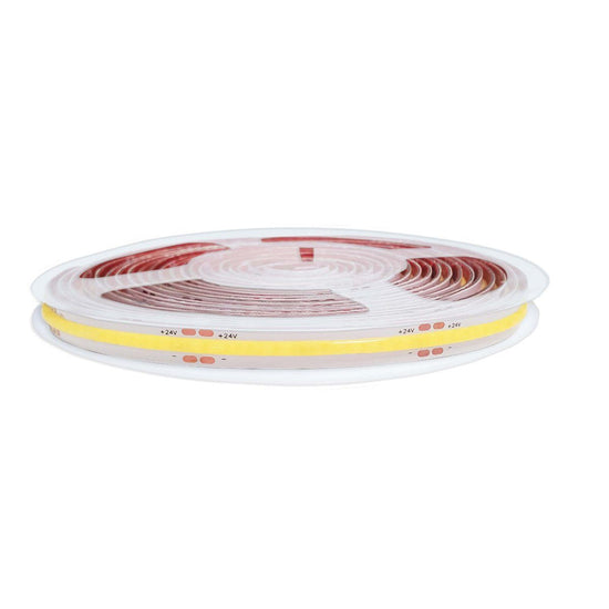 Dotless led strip light with red backing and yellow linear cover and visible copper ships wrapped on transparent reel