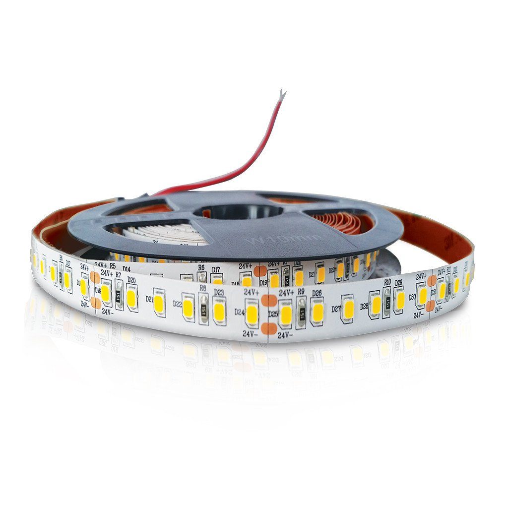 led strip light with yellow led chips and red backing wound loosely with exposed red wire on black reel on white background