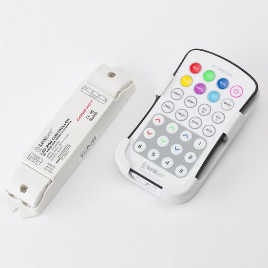 white rf controller with 28 buttons next to white rgb controller receiver